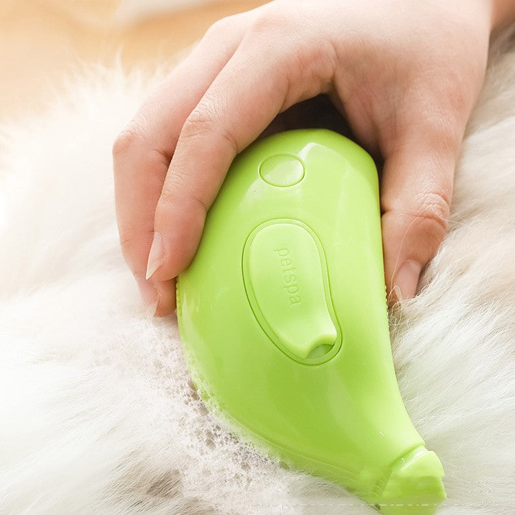 pet steam cleaning brush in use, gently brushing a pet's fur while removing hair and dirt.