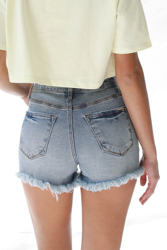 Shorts vaqueros deshilachados con lazo de cinta