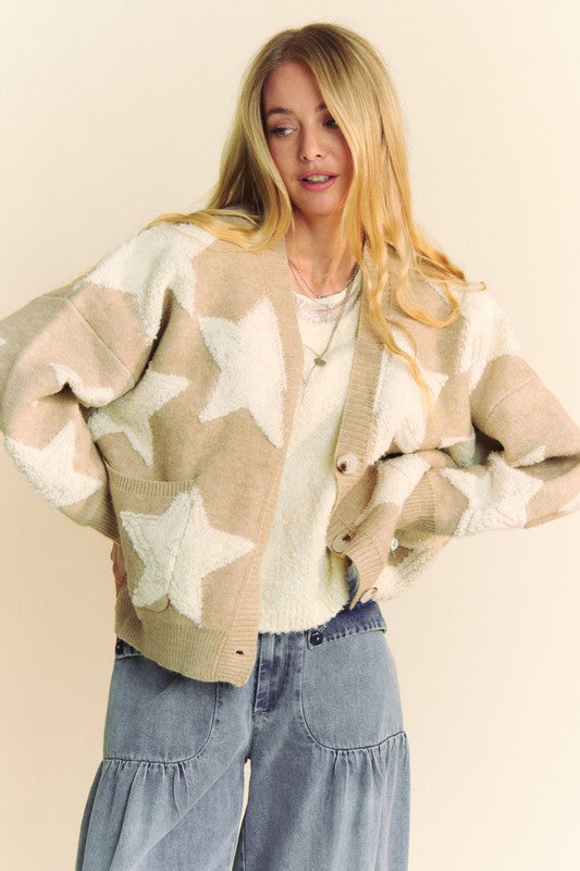 Stylish woman in a fuzzy star button-down cardigan, perfect for winter season and online shopping. Cozy sweater outfit idea.