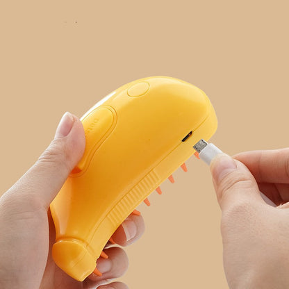 Image of a hand holding a yellow pet steam cleaning brush while connecting a charging cable.