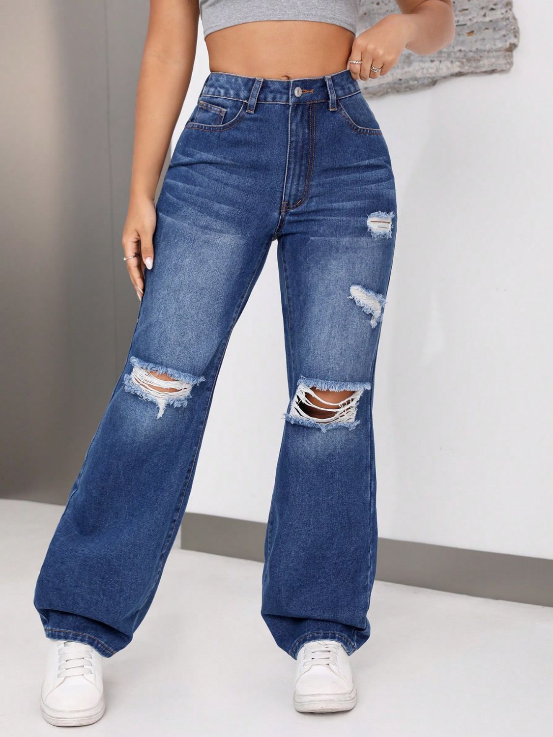 Jeans desgastados con bolsillos