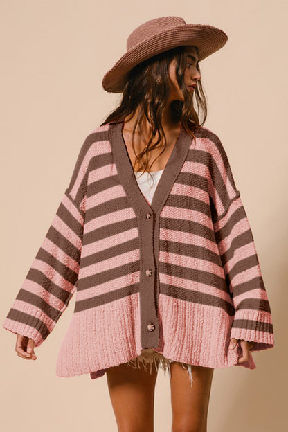 Stylish pink and brown striped V-neck button-up cardigan with a curved hem, perfect for casual or formal occasions.