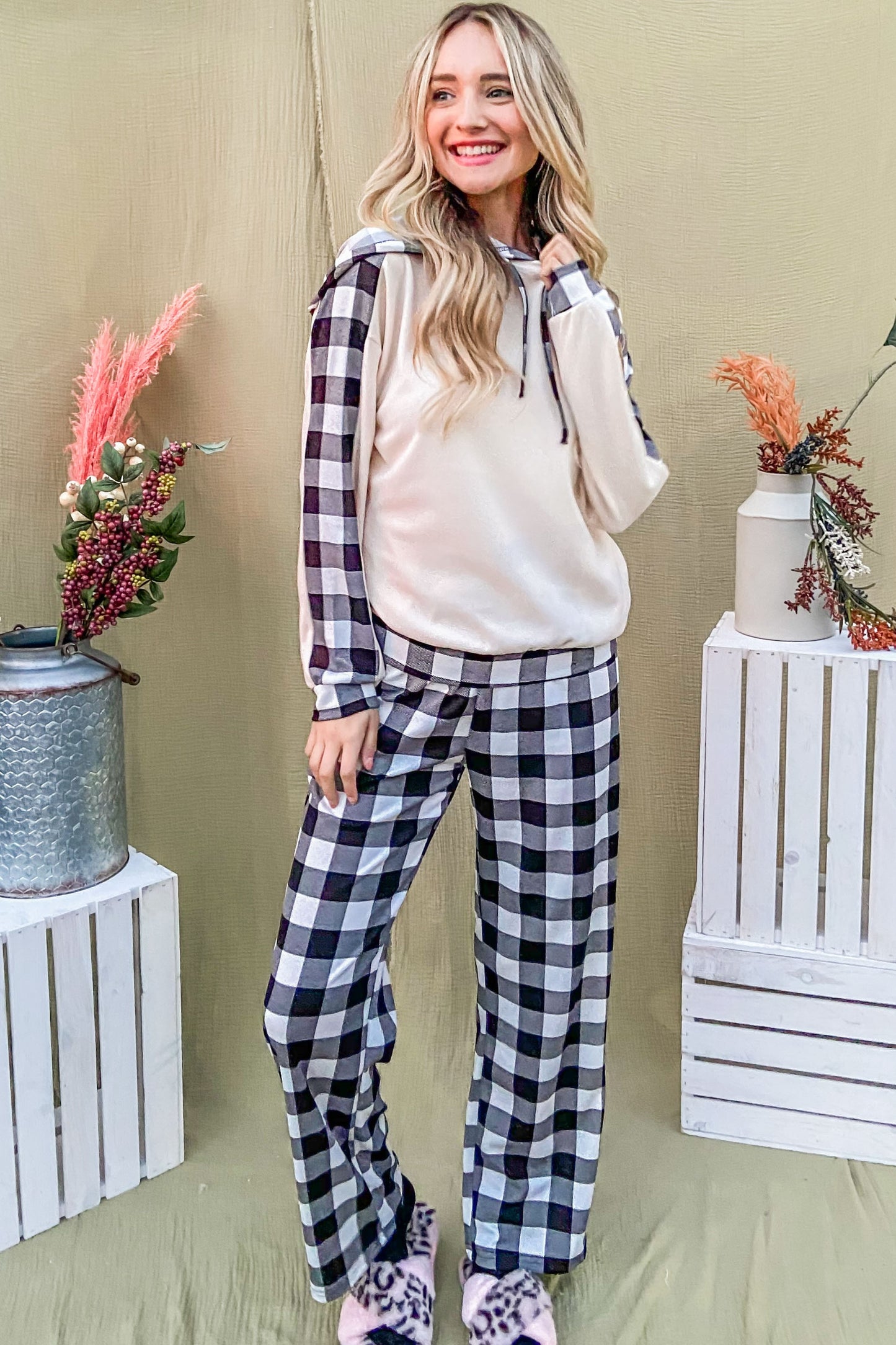 Stylish woman in drawstring hooded top and plaid pants lounge set, perfect for cozy Christmas sweaters and new arrivals.