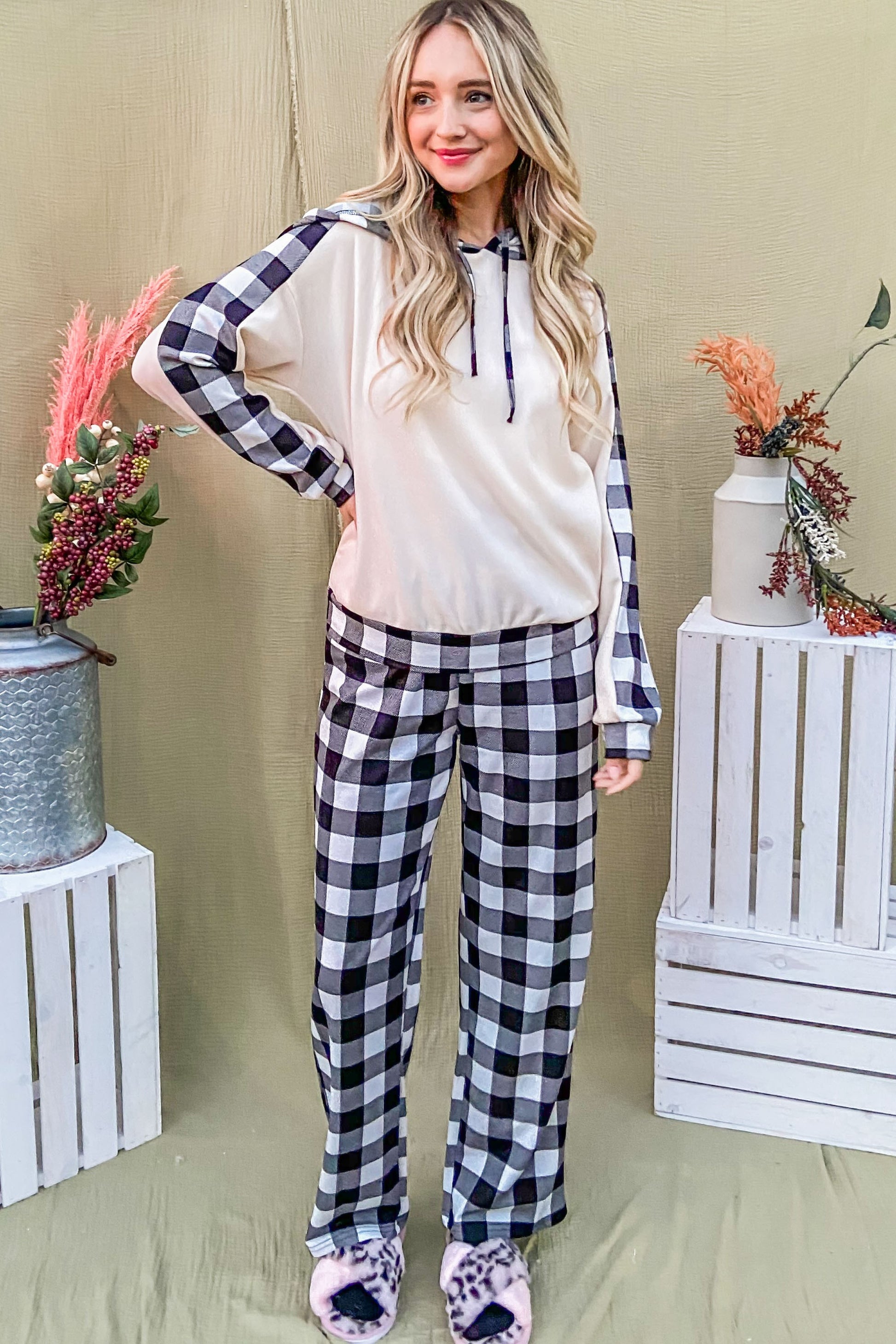 Cozy drawstring hooded top paired with plaid pants, perfect for stylish lounging and festive new arrivals.