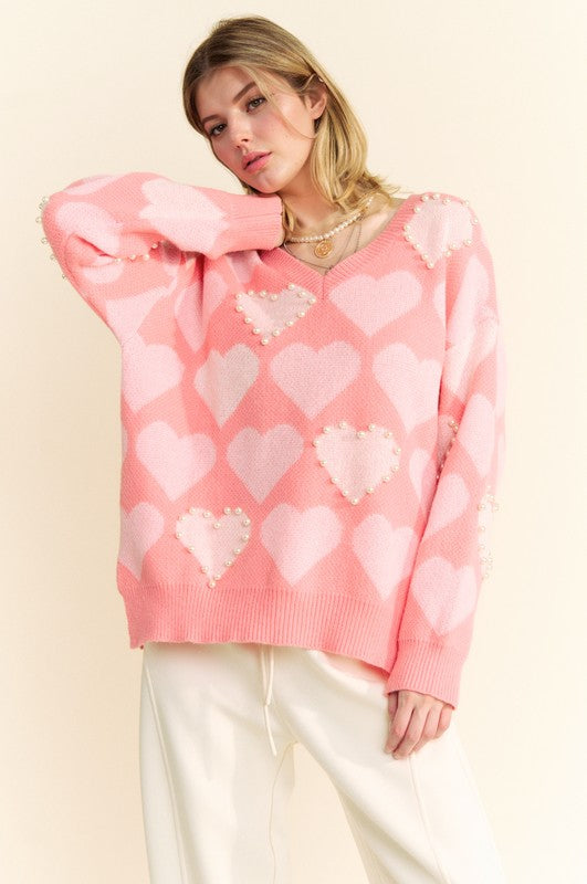 Davi & Dani pink heart pearl V-neck sweater with side slits, stylish and modern design perfect for layering.