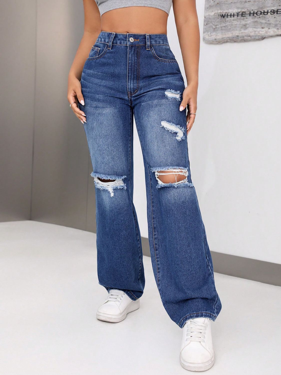 Jeans desgastados con bolsillos